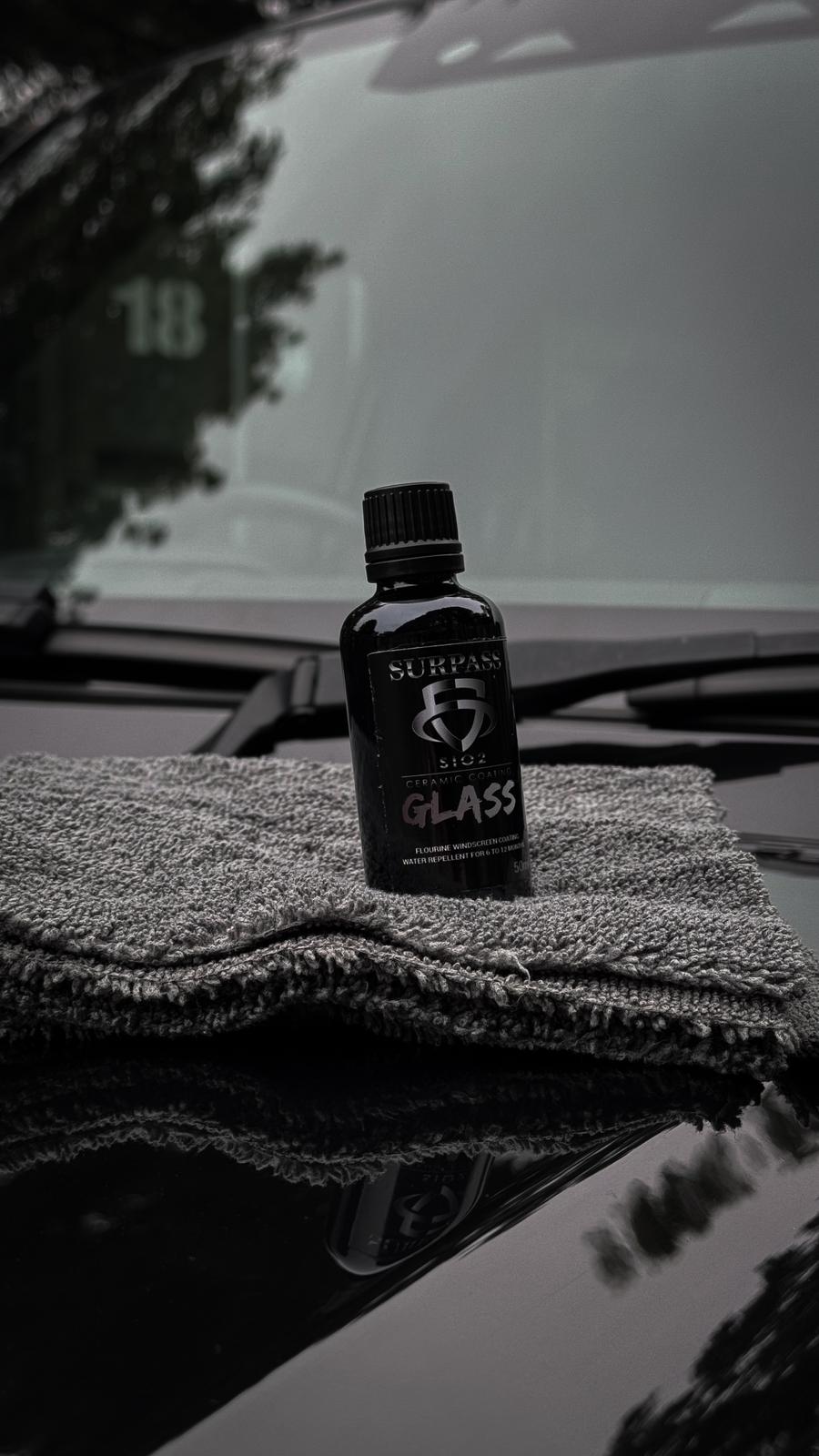 Bottle of Surpass Glass Coating for car protection.